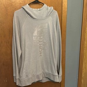 The north face hoodie sweatshirt with a pocket in front.